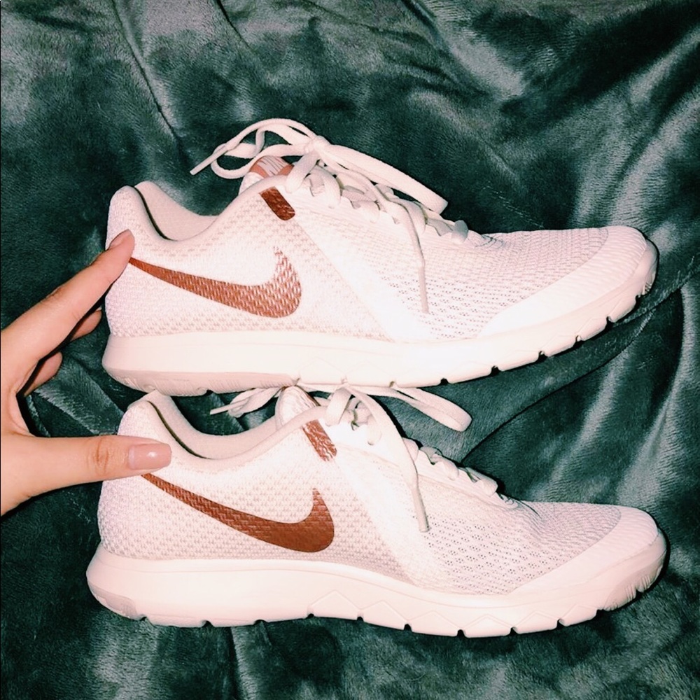 Nike rose gold and white shoes